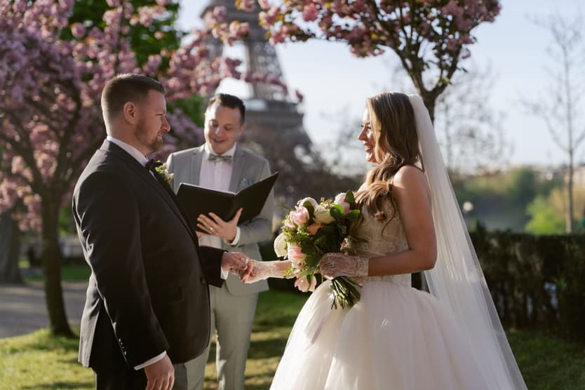 Michael and Aphrodite with the officiant during their Paris elopement ceremony