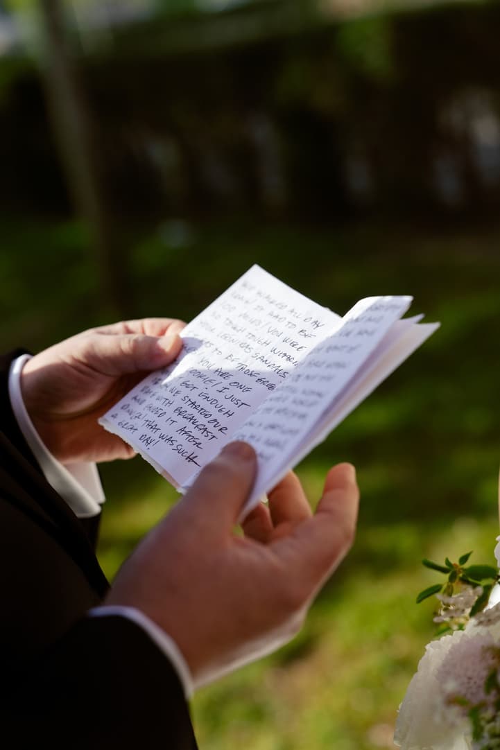 Michael reading his handwritten vows to Aphrodite