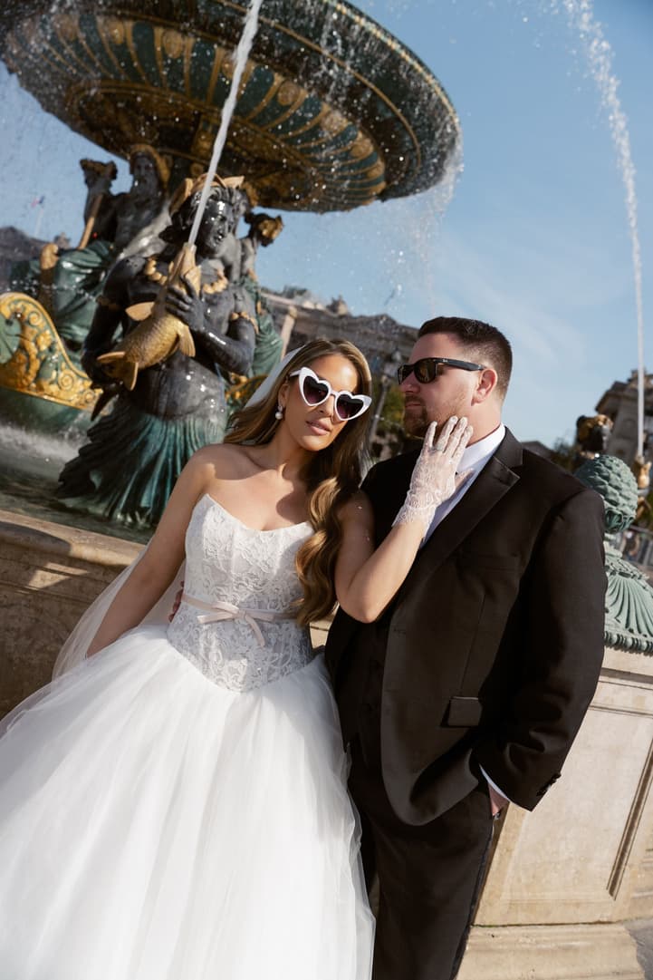 Aphrodite and Michael in sunglasses at the fountain of Place de la Concorde