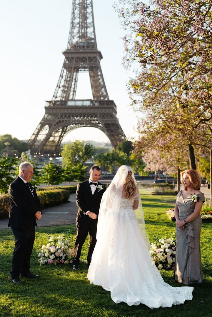 Victoria walks down the aisle to Tyler in the Trocadéro gardens, her family on either side