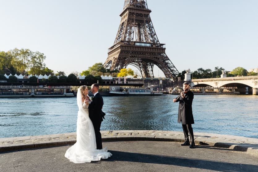 Victoria and Tyler's first dance on the bank of the Seine, a violinist playing beside them under the Eiffel Tower