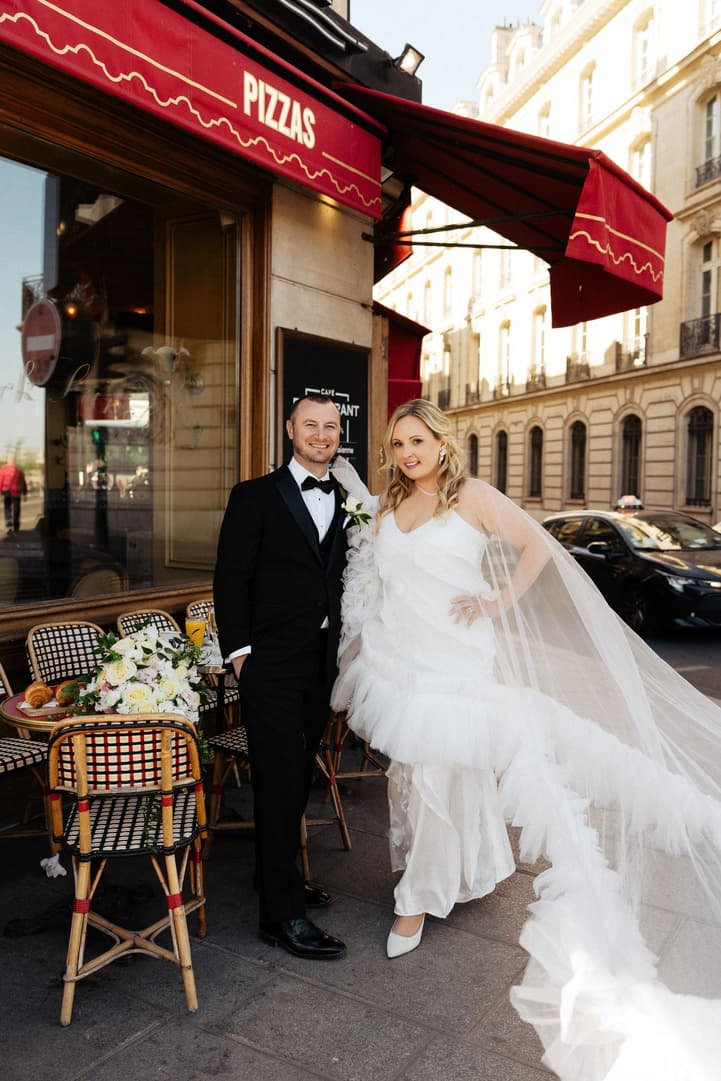 Victoria and Tyler outside La Frégate, her ruffle cape trailing over the pavement