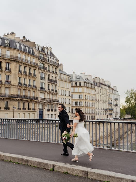The oldest island in Paris. The Seine on all sides. Notre-Dame rising through the morning mist. And two people who flew across the world to say I do in the city that invented romance. 💞